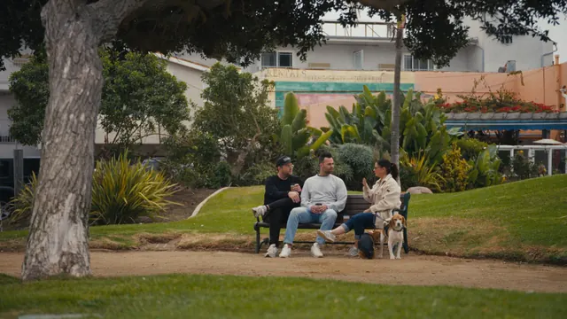 Autumn Bignami talks with Josh and Tommy on a park bench.