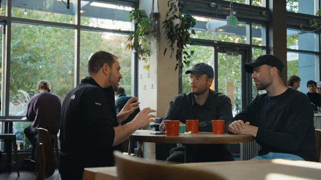 Dr Joseph Sakran talks with Josh and Tommy in a café in Baltimore.