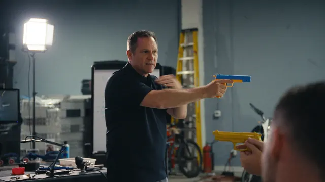 Dutch Merrick demonstrates a shooting stance with a training pistol.