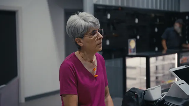 Gina McComb at a gun shop near the Utah–Nevada border, explaining why she decided to buy her first gun later in life.