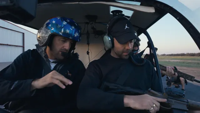 Pilot Dustin Johnson, in a stars-and-stripes helmet, with Tommy Jackett before the feral hog hunt in Texas.