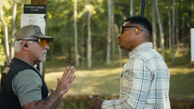 Coach Joe Calabrace, a 20-year military veteran, with Mychael Waller at Cross Creek Clays near Nashville, Tennessee.