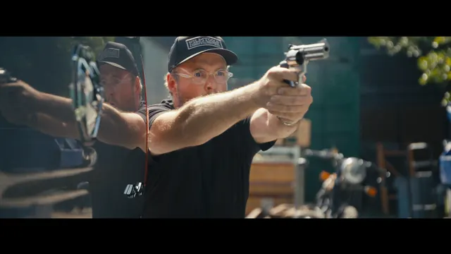 Josh fires blanks in a mock shootout staged by Dutch Merrick's team in Los Angeles.
