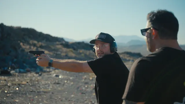Josh takes aim with a pistol at the desert range outside Las Vegas.
