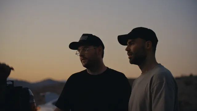 Josh and Tommy at sunset after their first day on a range, outside Las Vegas.