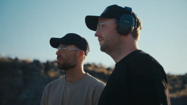 Josh and Tommy in eye and ear protection at a desert range outside Las Vegas, on their first day around live fire.