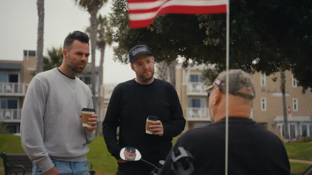Josh and Tommy, coffees in hand, talk with a local in Santa Monica.