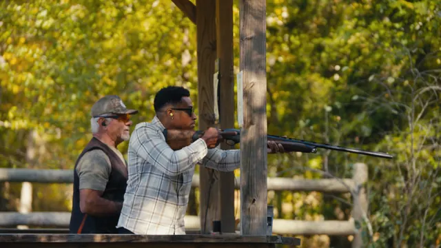 Mychael Waller shoots clays as coach Joe Calabrace looks on at Cross Creek Clays near Nashville, Tennessee.