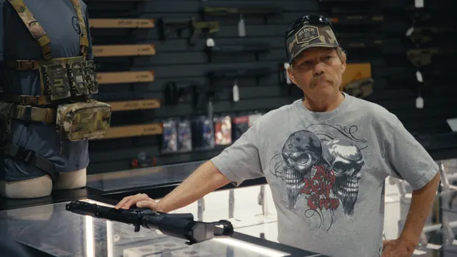 Raymond Erickson at the counter of a gun shop near the Utah–Nevada border. He once drew his pistol to stop a man attacking his wife.
