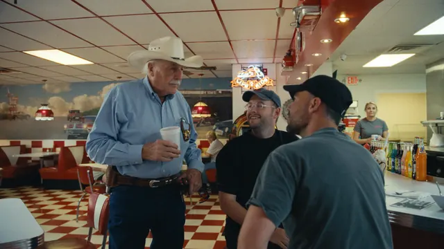 Sheriff Parnell McNamara meets Josh and Tommy at Kim's diner in Waco, Texas.