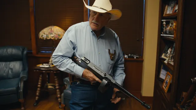 Sheriff Parnell McNamara with one of his two 1928 Thompson submachine guns in his office in Waco, Texas.