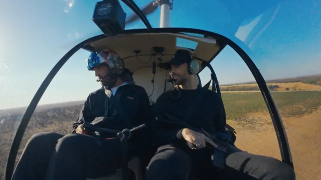 Tommy and the pilot, rifles in hand, in the air over Texas during the feral hog hunt.
